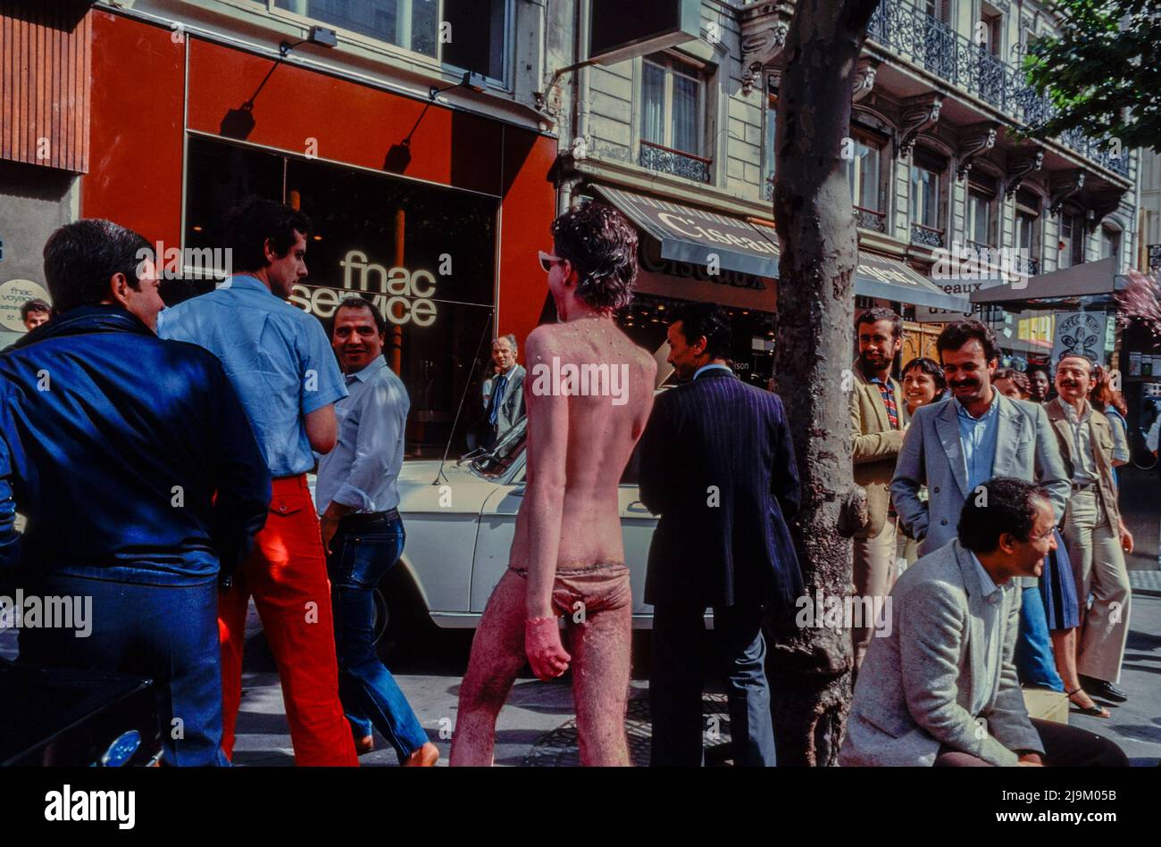 Paris, France, Man in Pink Makeup, walking away, being harassed by Passerby's on Street, LGBT Fierté, Gay Pride March, 1982, Homophobia, 1980s Archives, gay protest vintage Stock Photo
