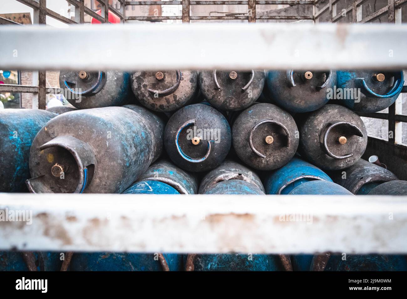 Many old propane gas bottles on truck Stock Photo