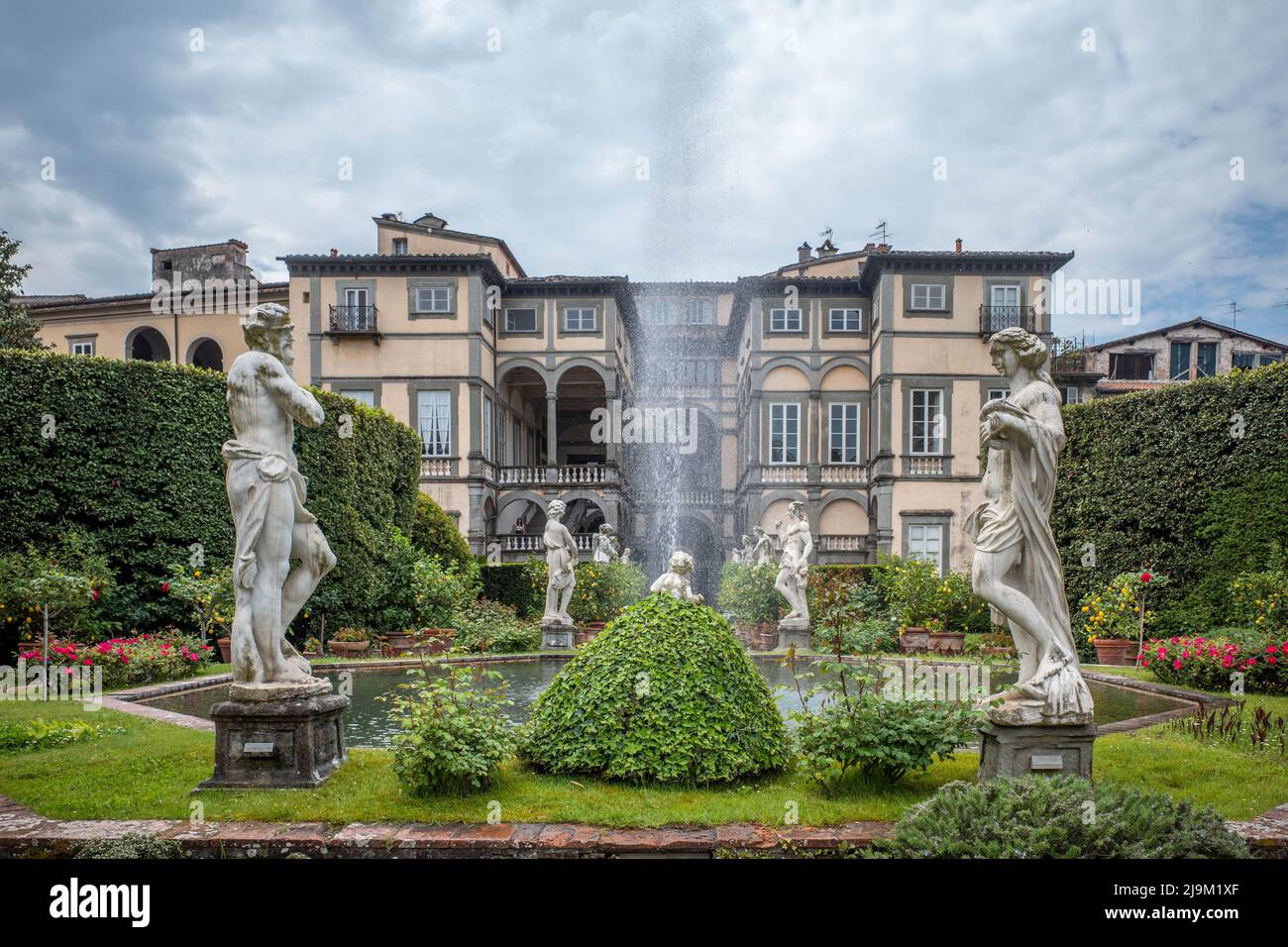 Luuca, Tuscany, Italy, 09 May 2022 - Gardens of Pfanner villa inside Medieval city walls of Lucca, with grass fountains and statues. Stock Photo