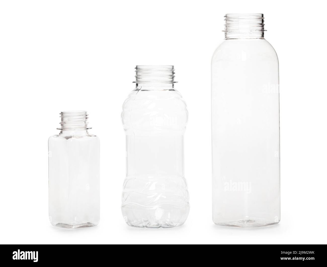 three different empty plastic bottles isolated on white background