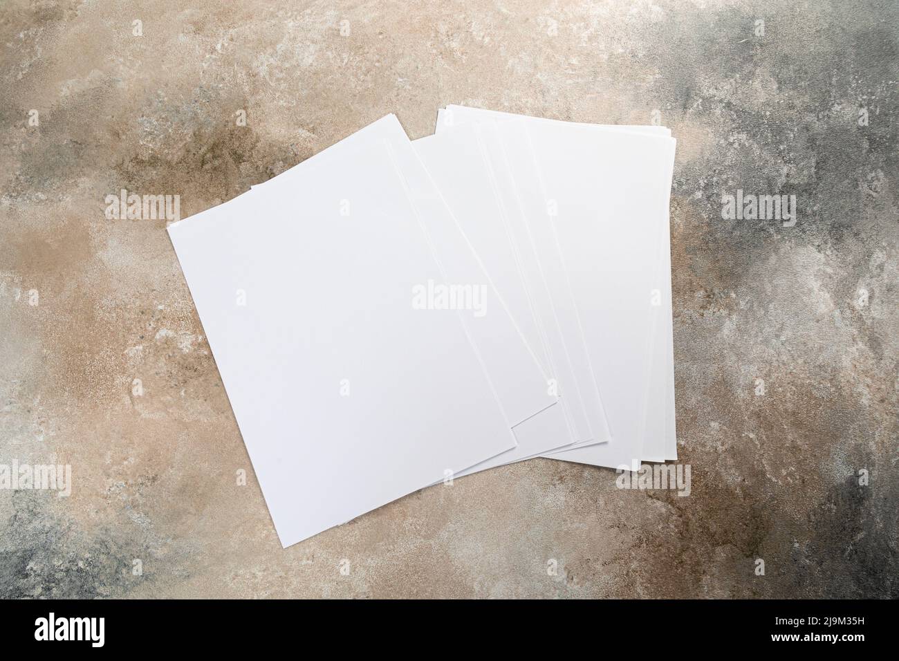 stack of white business card sheet of paper a4 stack on grunge table Stock Photo Alamy