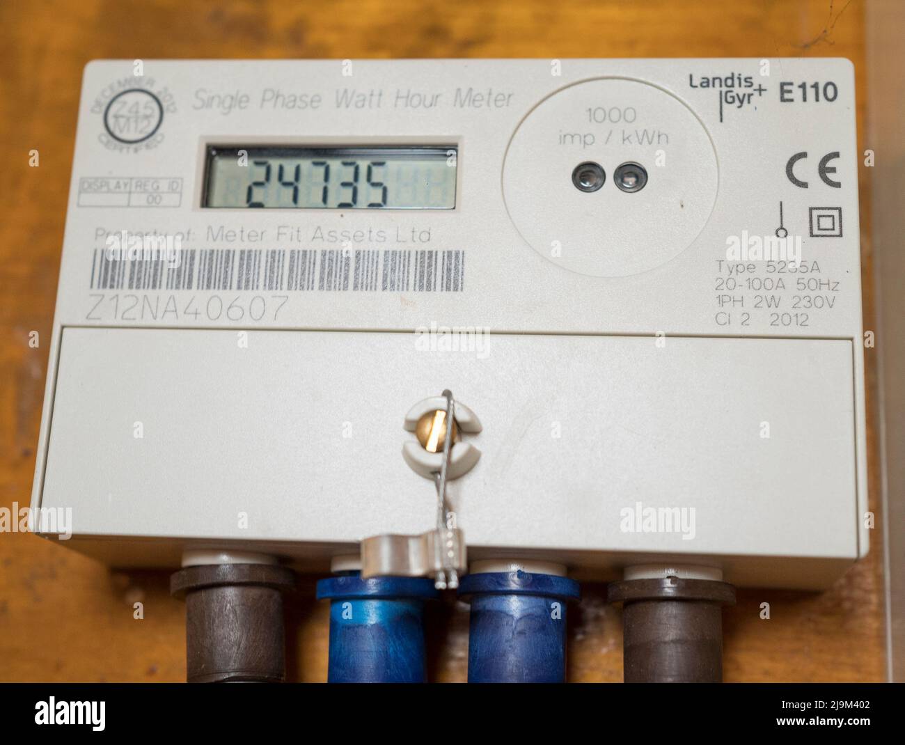 Close up of a Landis+Gyr domestic electricity meter in a residential, UK property, recording energy usage (Single Phase Watt Hour Meter). Stock Photo