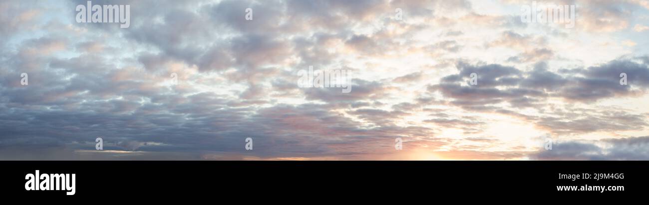 Sunset sky with clouds panoramic background Stock Photo - Alamy