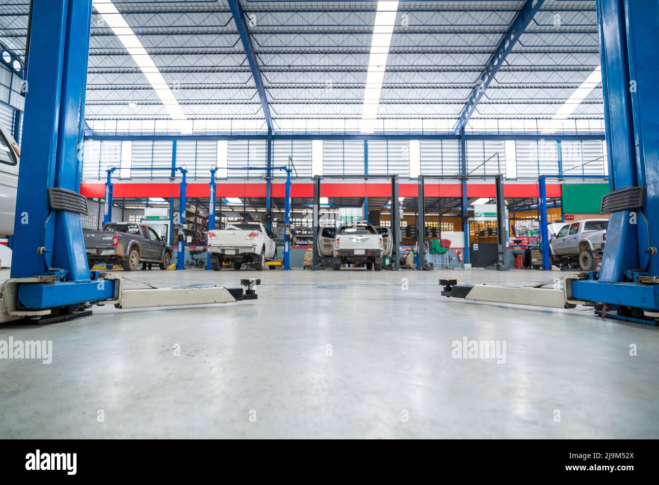 An Electric Lift For Cars In The Service Put On The Epoxy Floor In New 