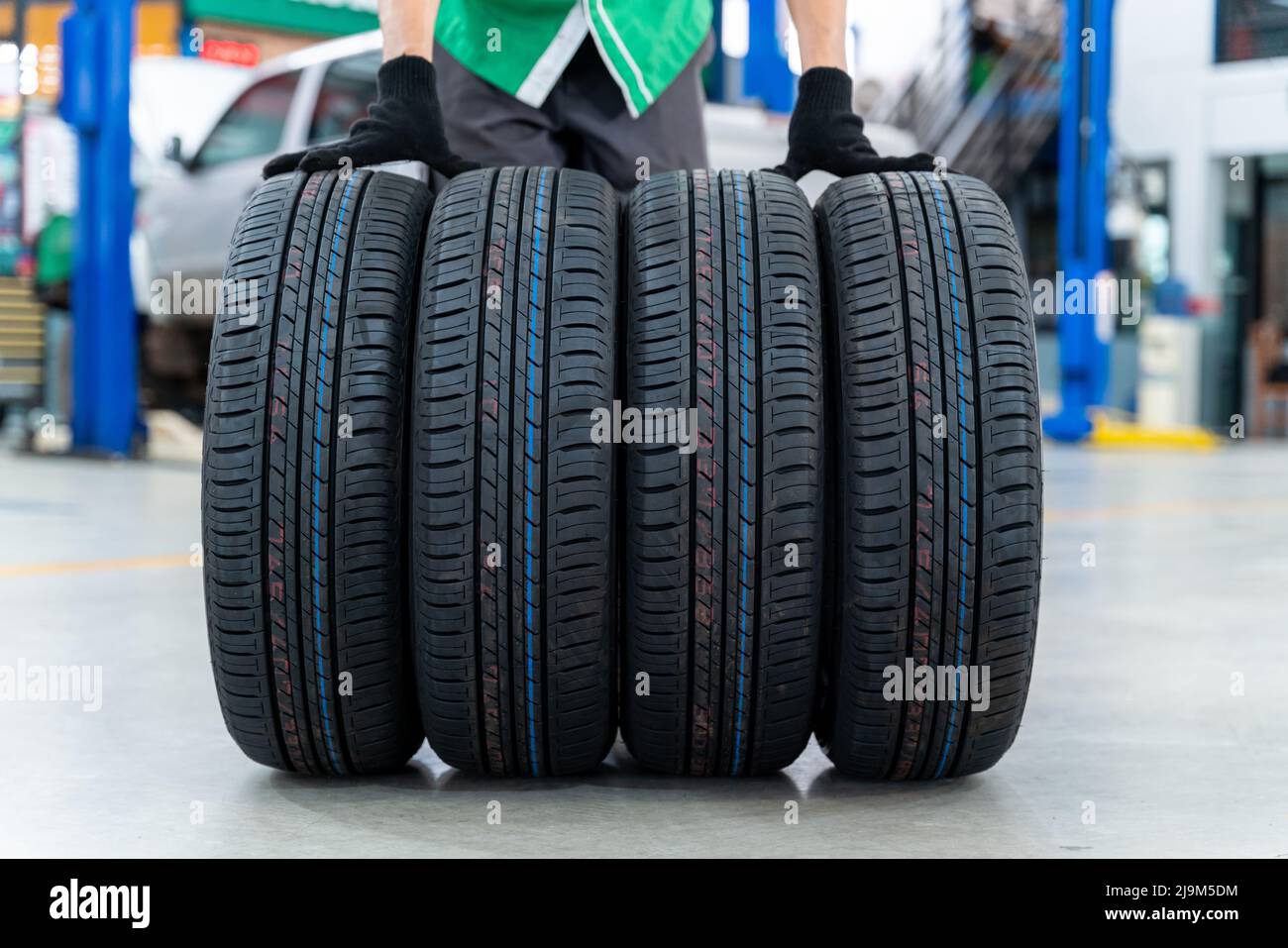 4 new tires in Car repair center Stock Photo Alamy