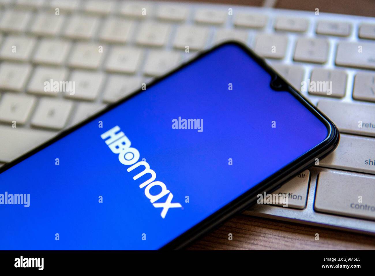 In this photo illustration, an HBO Max logo seen displayed on a ...