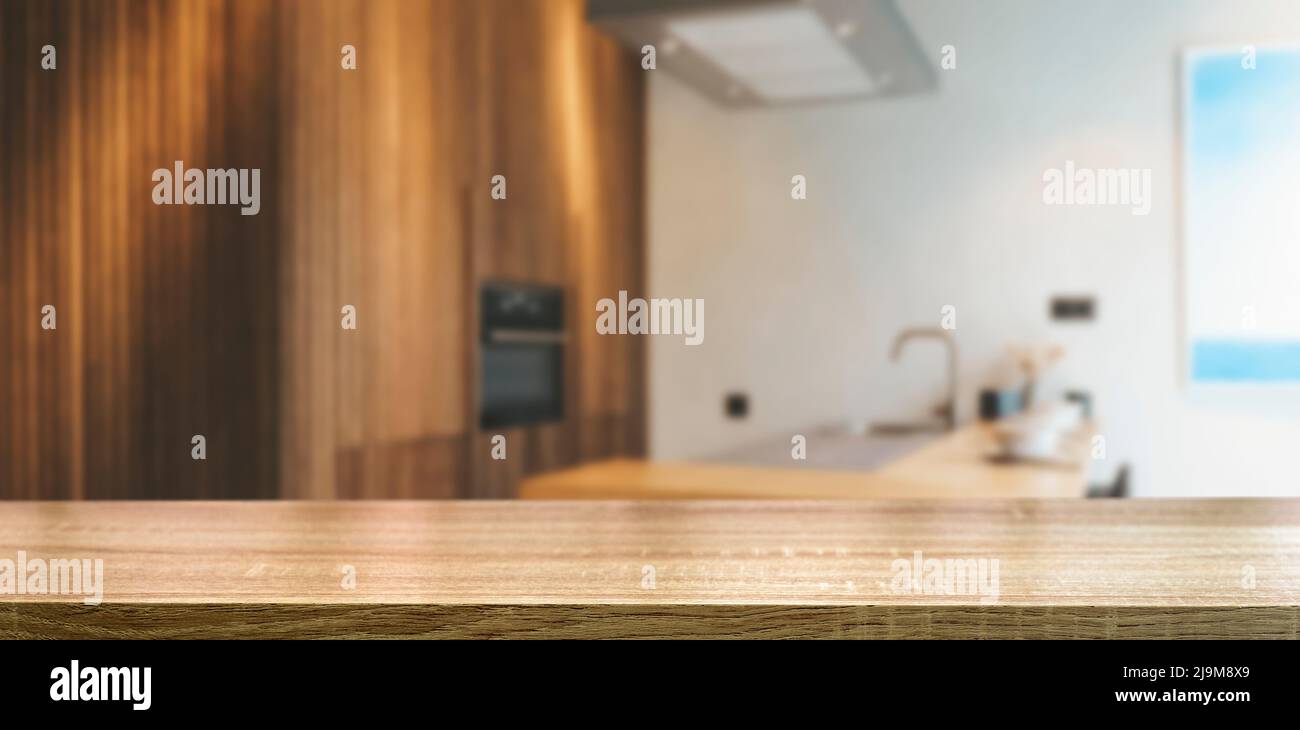 Kitchen table background. Wooden table in the interior of a home kitchen during the day. Food, cooking, groceries mockup. High quality photo Stock Photo