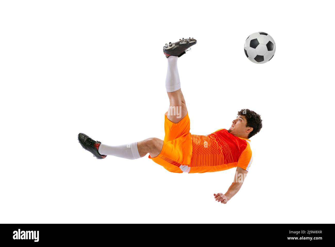 Professional football, soccer player in motion isolated on white studio background. Concept of sport, match, active lifestyle, goal and hobby Stock Photo