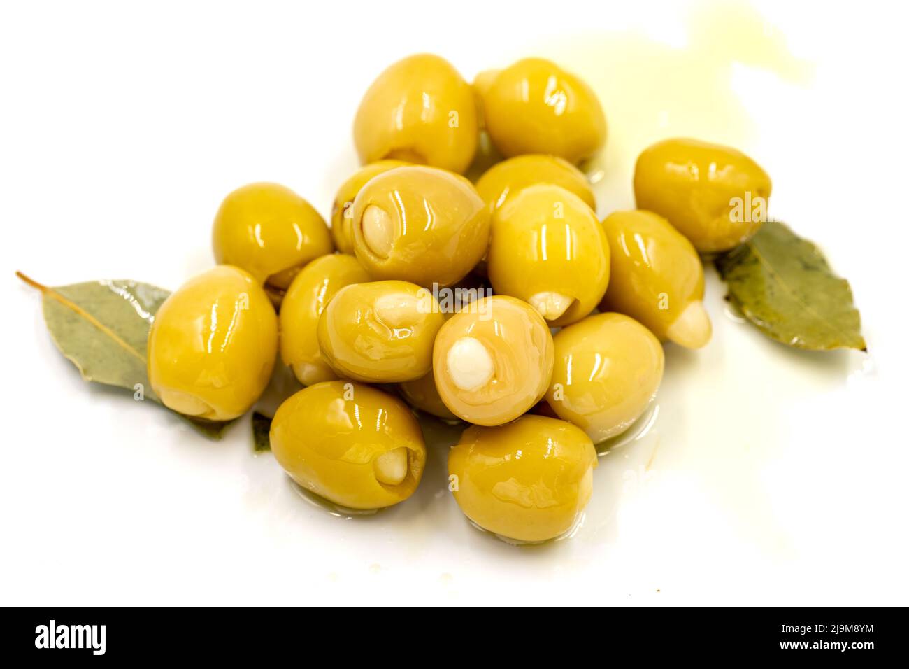 Green olives stuffed with cheese. Cheese filled olives for breakfast on isolated white