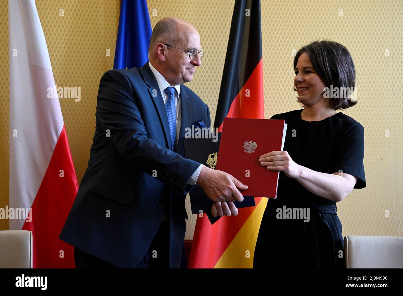 German Foreign Minister Annalena Baerbock and Polish Foreign Minister Zbigniew Rau exchange documents after signing a 'Memorandum of Understanding' for the permanent financing of the International Youth Meeting Centre (IYMC) of the Kreisau Foundation for European Understanding, at the Foreign Office in Berlin, Germany May 24, 2022. Tobias Schwarz/Pool via REUTERS Stock Photo