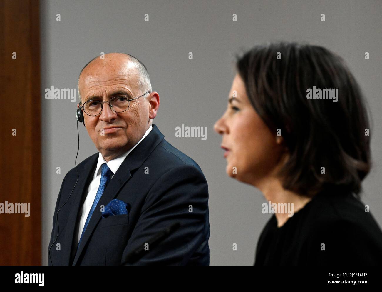 Polish Foreign Minister Zbigniew Rau listens to German Foreign Minister Annalena Baerbock during a joint news conference in Berlin, Germany May 24, 2022. Tobias Schwarz/Pool via REUTERS Stock Photo