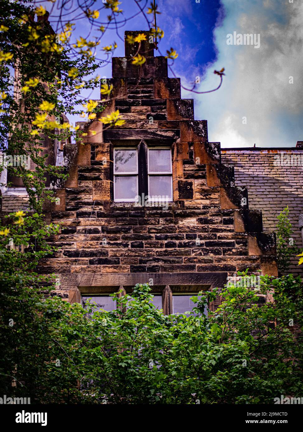 Old Scottish cottage with garden and flowers Stock Photo