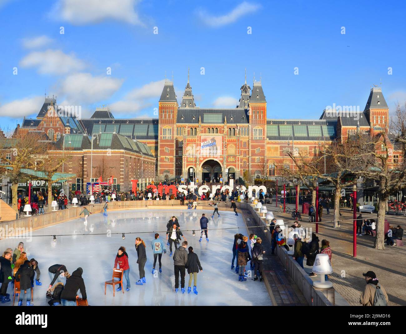 Tourists enjoying ice skating at the famous sign 'I amsterdam' at Museum Square near Rijksmuseum in Amsterdam. Stock Photo