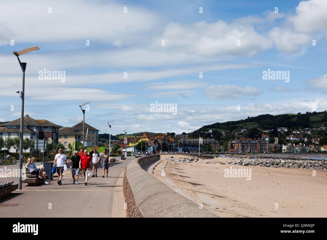 Minehead, Somerset, UK.  22 May 2022.  UK weather: People enjoy a walk along the coast this morning. Stock Photo