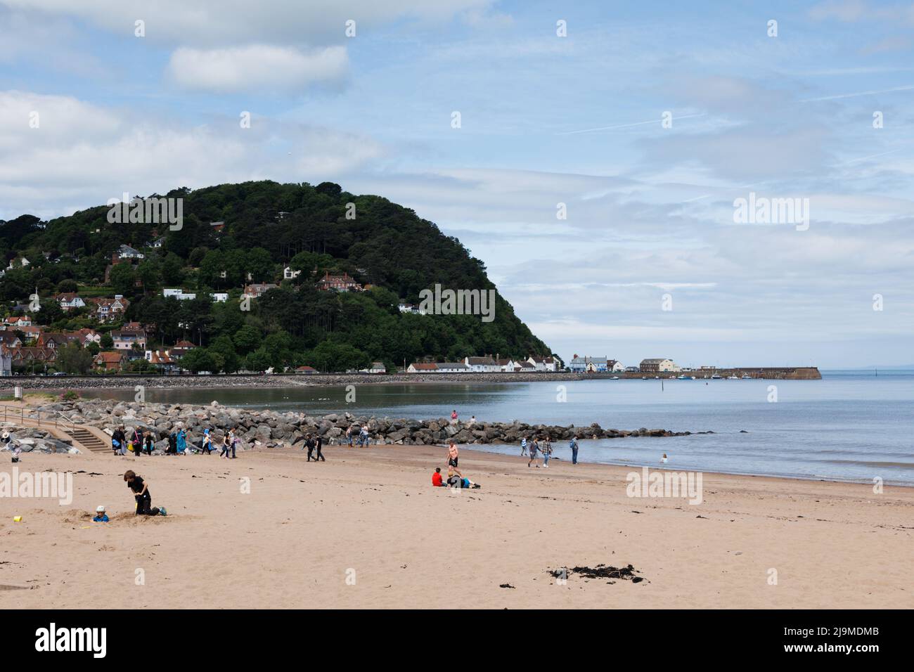 Minehead, Somerset, UK.  22 May 2022.  UK weather: People enjoy a walk along the coast this morning. Stock Photo
