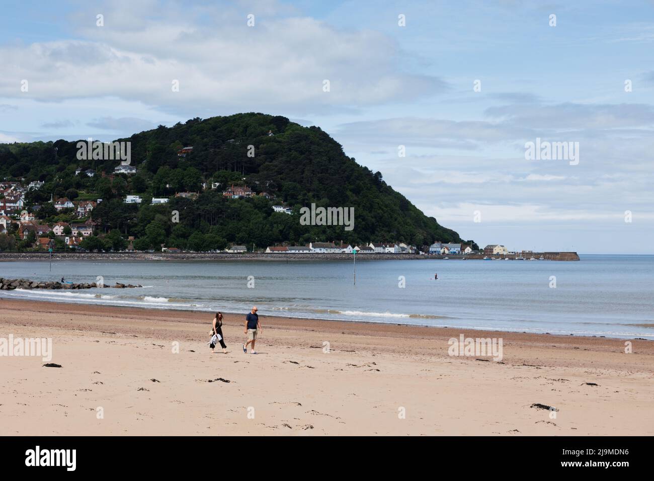 Minehead, Somerset, UK.  22 May 2022.  UK weather: People enjoy a walk along the coast this morning. Stock Photo