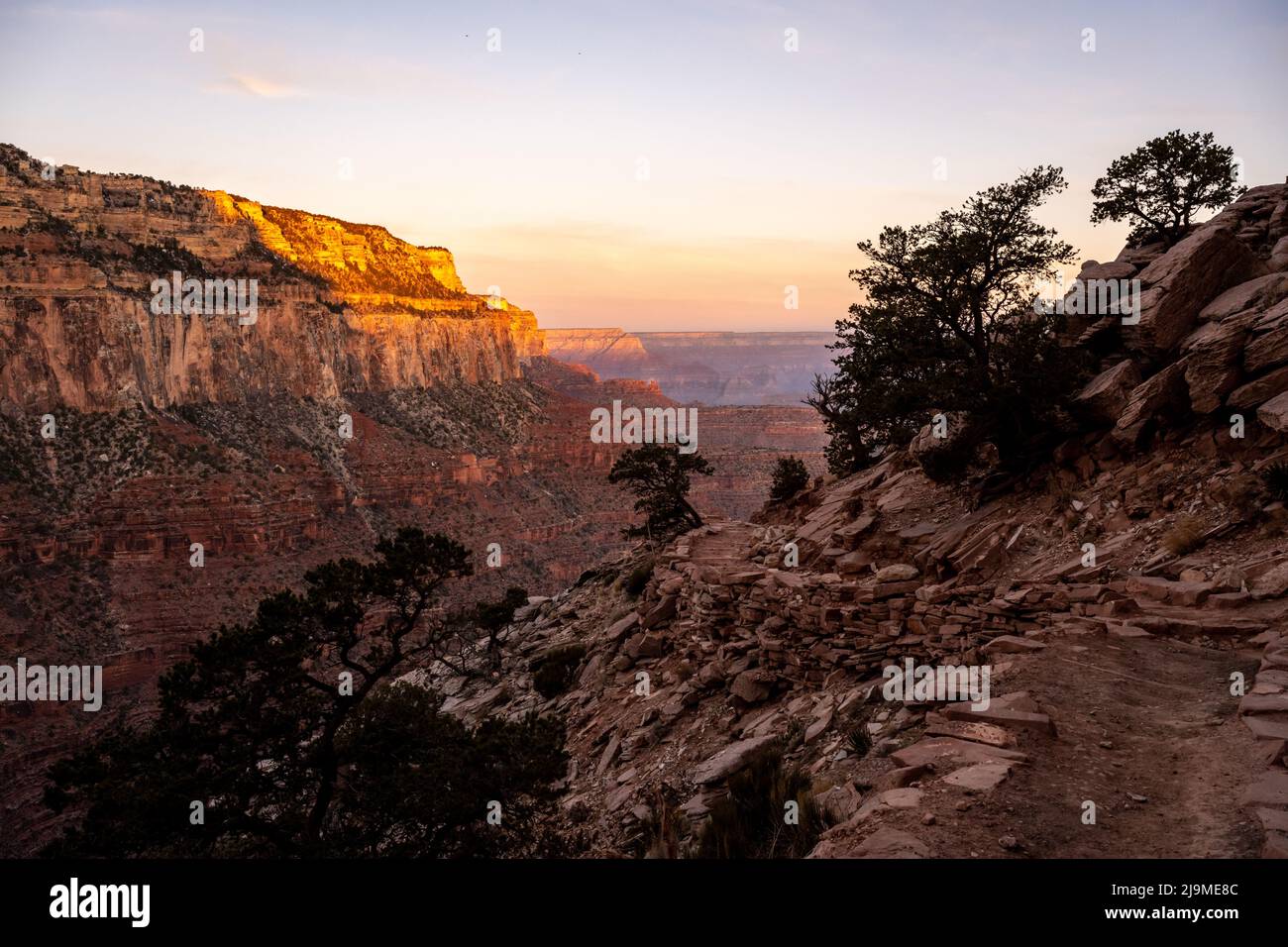 South Kaibab Trail Snakes Around The Canyon Wall At Sunrise on a clear morning Stock Photo