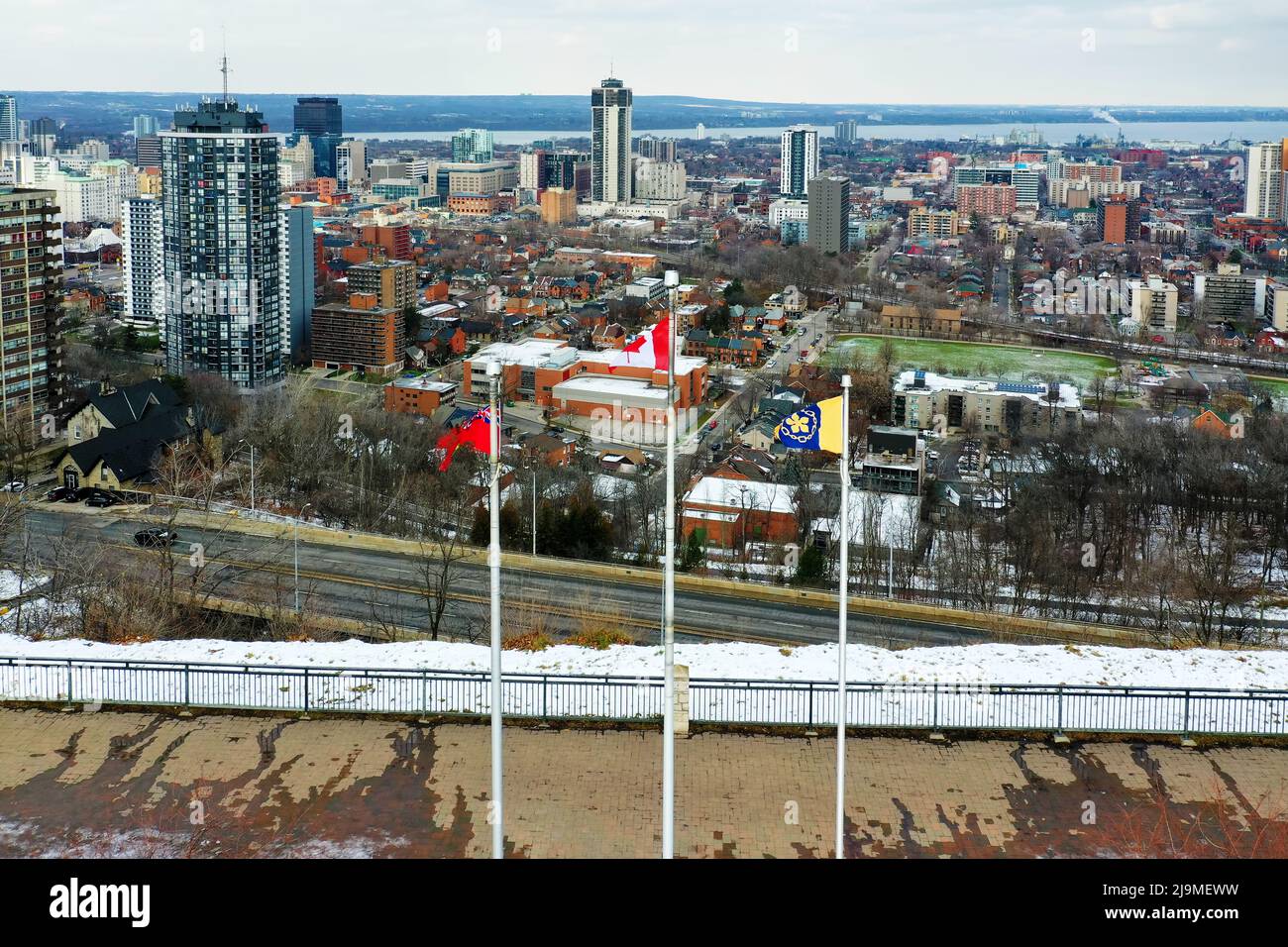 An aerial of Hamilton, Ontario, Canada downtown with flags in foreground Stock Photo