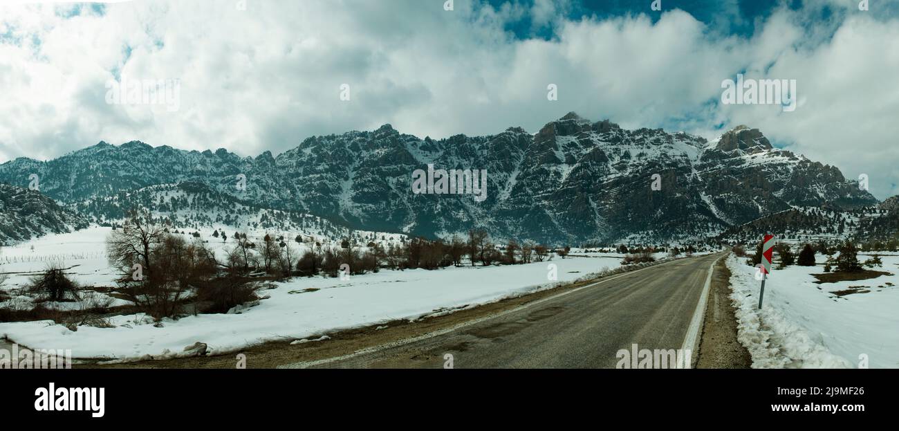 snowy mountain scene in winter season in Turkey. Snow, road and mountain in panaromic mode, very high resolution 68 megapixel picture. large format Stock Photo
