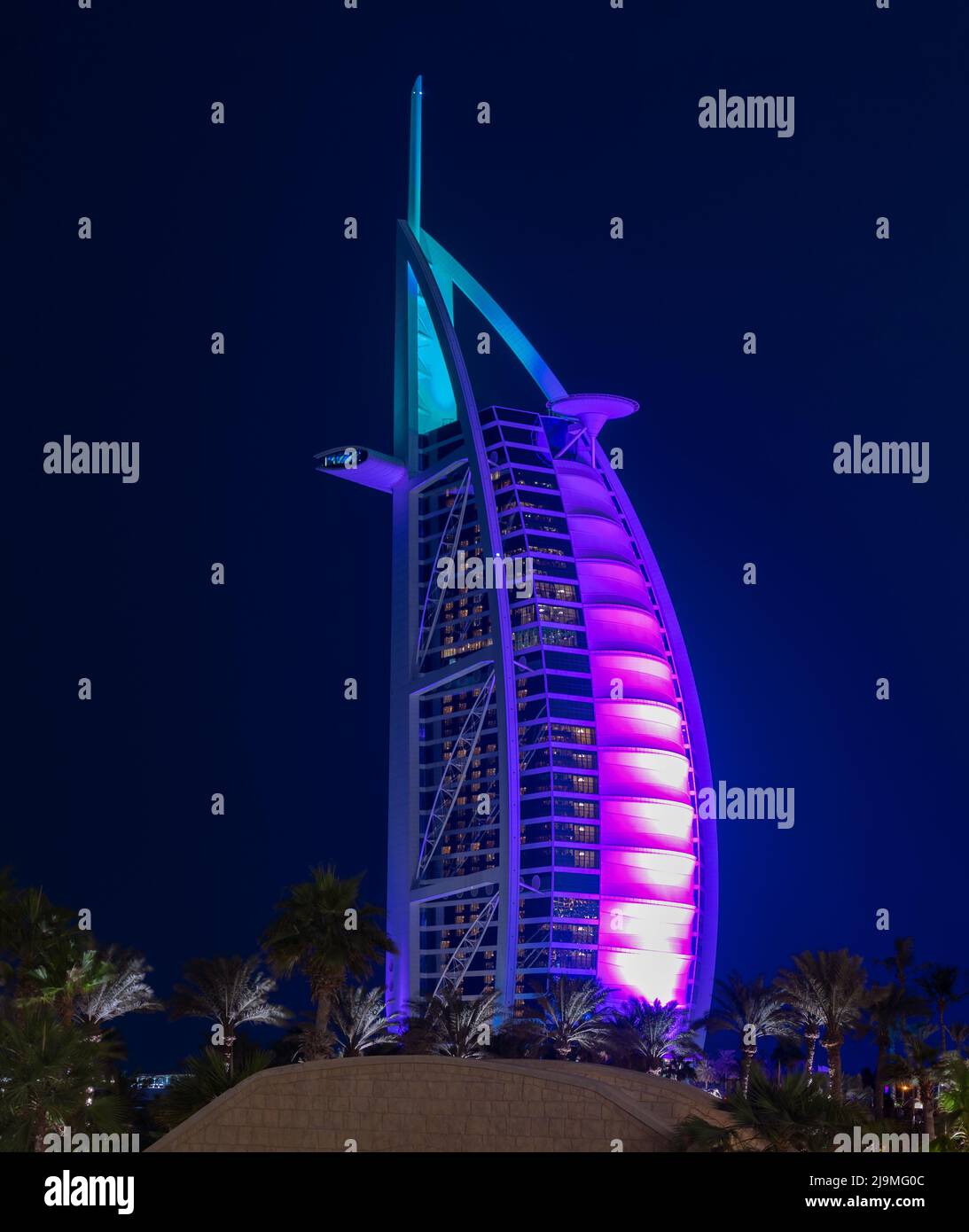 View of the illuminated Burj al Arab hotel captured from the Souq Madinat Jumeirah, Dubai, UAE. Stock Photo