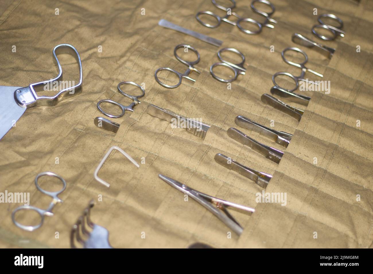 Set of surgeons' tools. Chrome scalpels and tweezers. Vintage set of