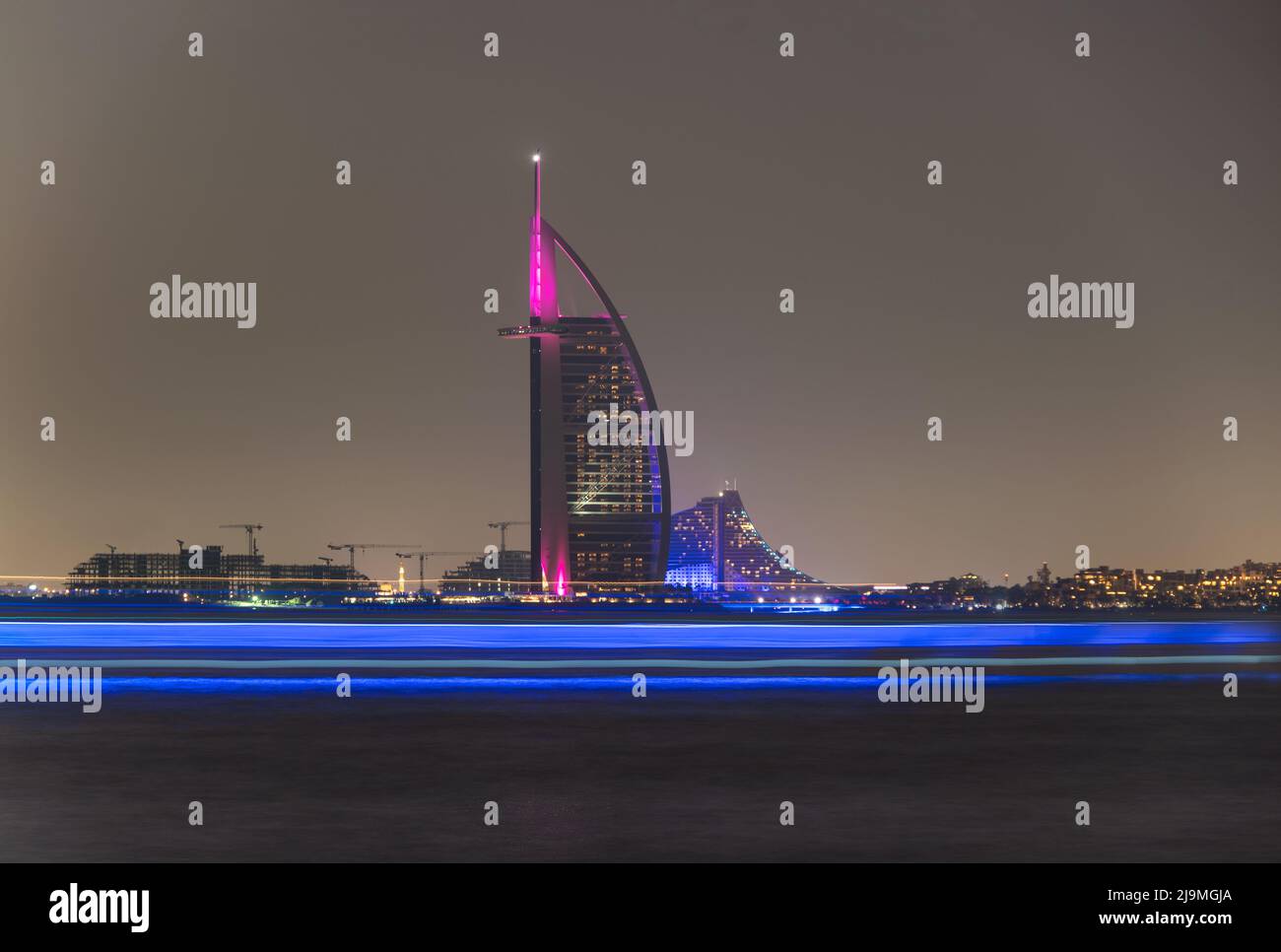 View of the illuminated Burj Al Arab, the iconic 7 star hotel in Dubai captured from the Palm Jumeirah . Stock Photo