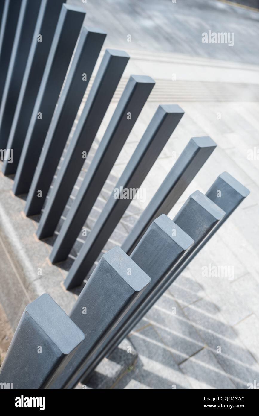 Thin walled, rectangular steel tubes filled with concrete give a strong, clean modern geometrical look and form a robust barrier. Stock Photo