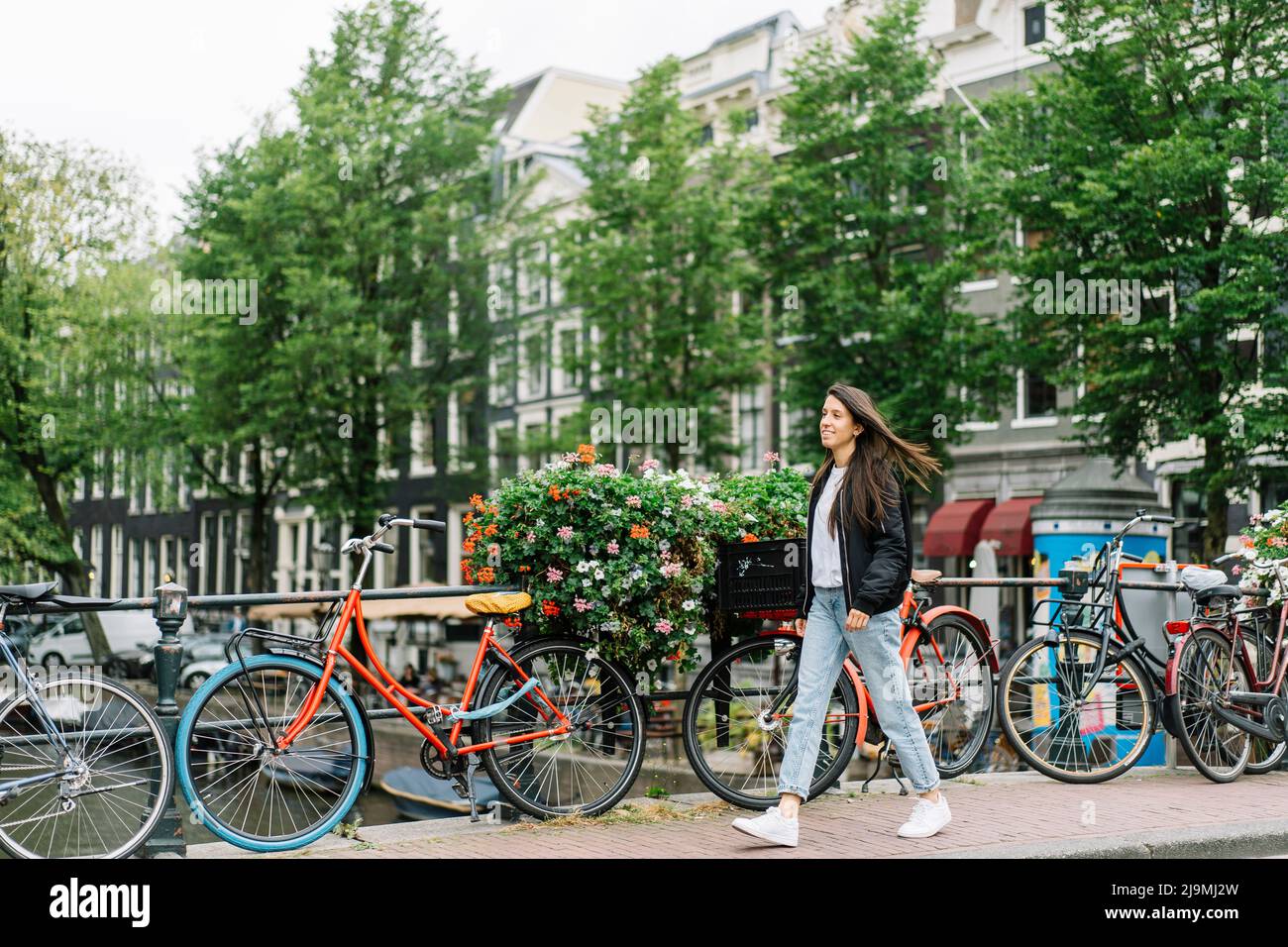 Bicycles blurred amsterdam canal background hi-res stock photography ...