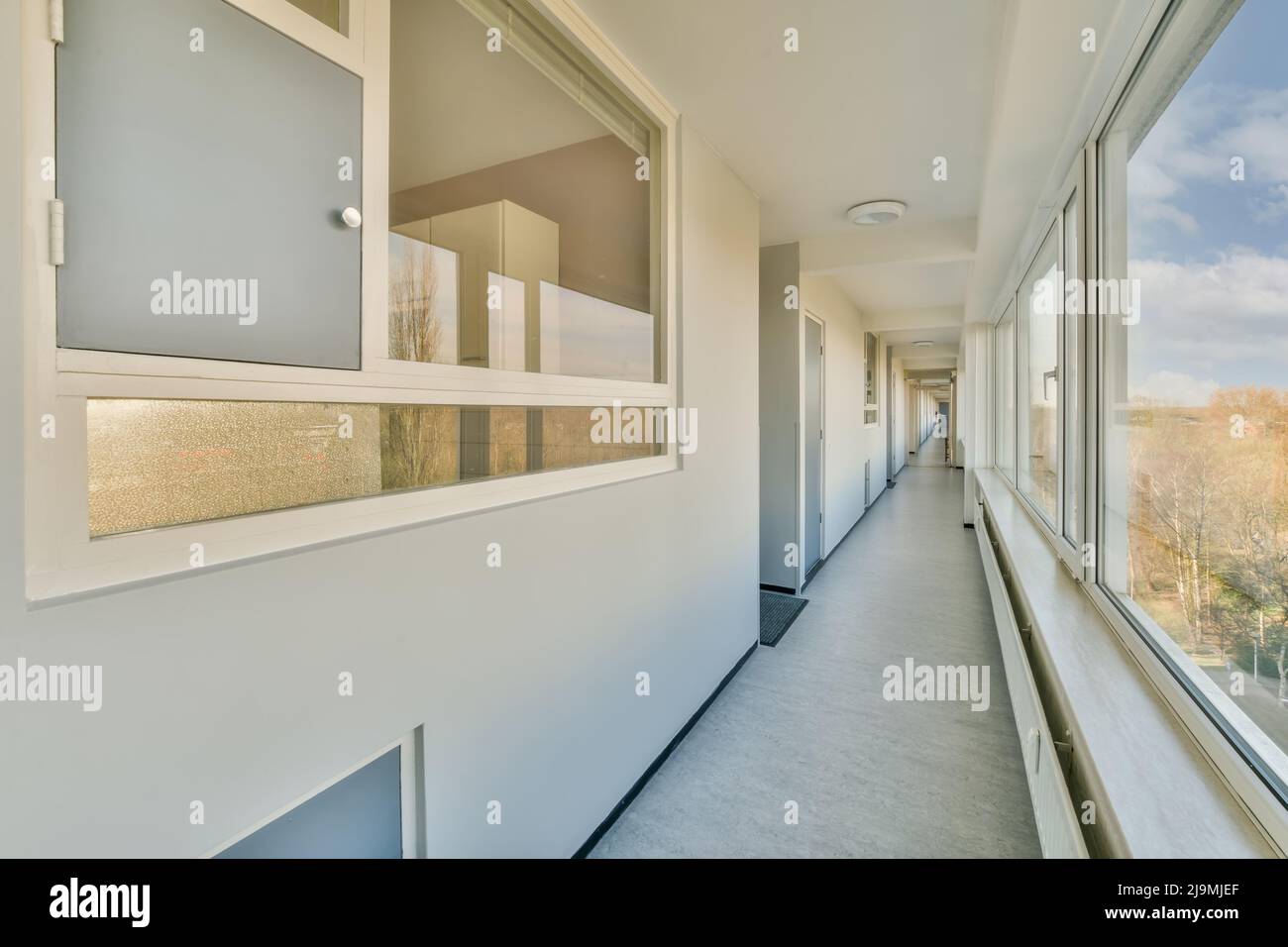 Long straight narrow passage of multistory residential apartment