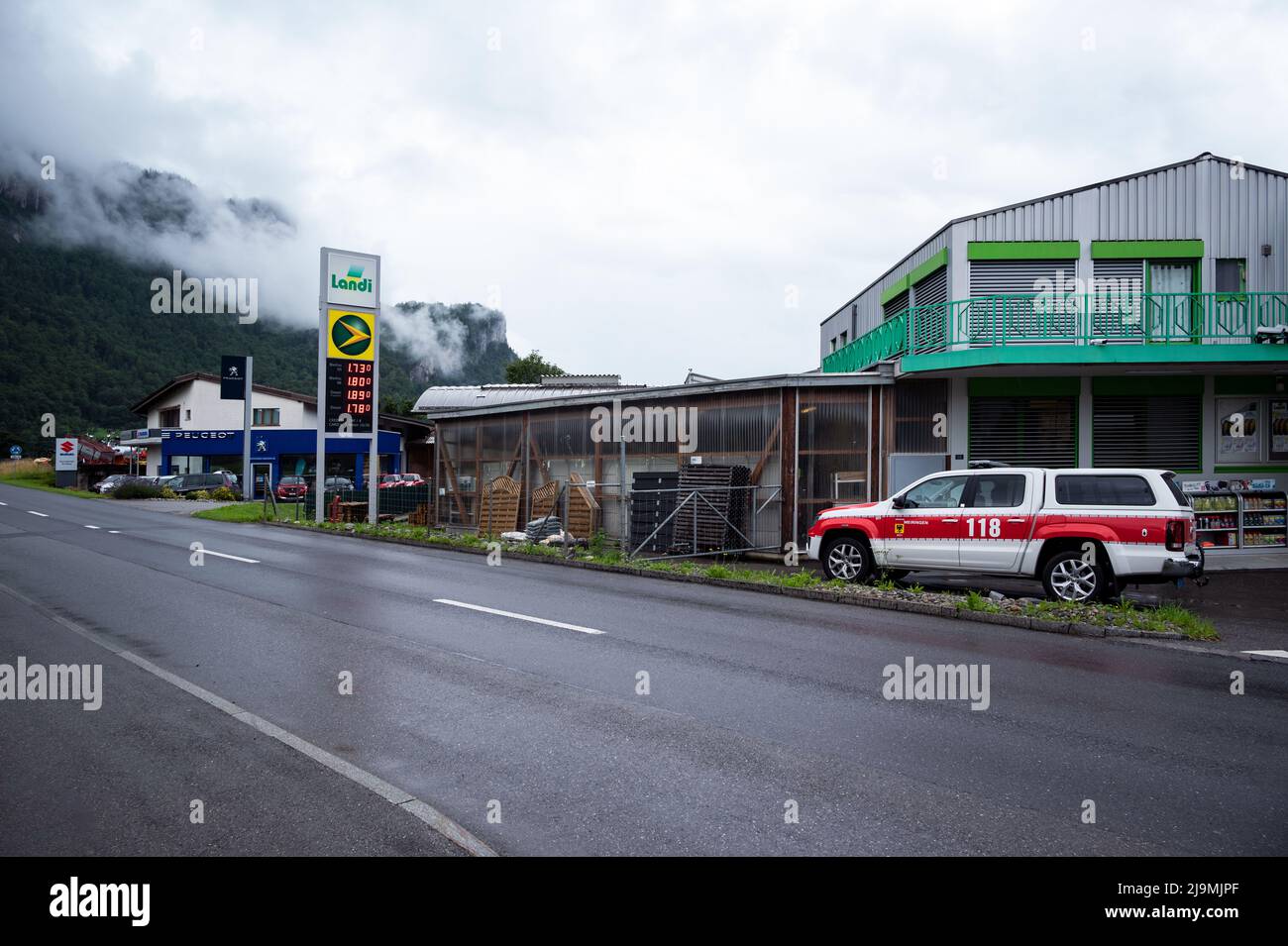 View of the petrol station with emergency vehicles parked in front of the Landi supermarket at Meiringen  village Switzerland Stock Photo