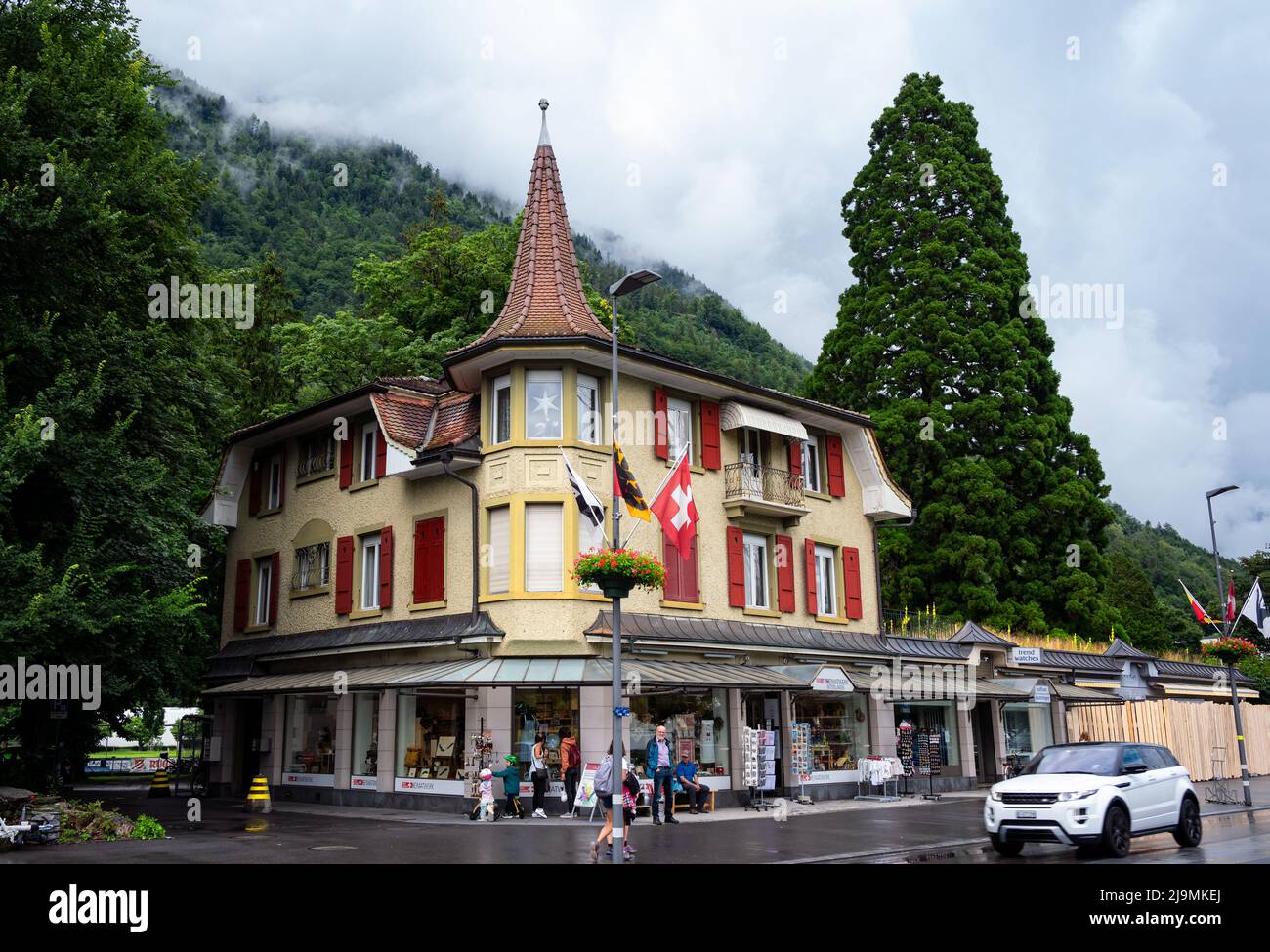 View of the central square in Interlaken with hotels and shops with tourists and visitors