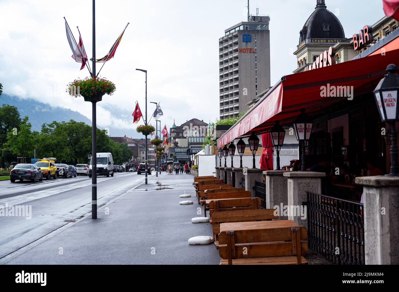 View of the central square in Interlaken with hotels and shops with tourists and visitors