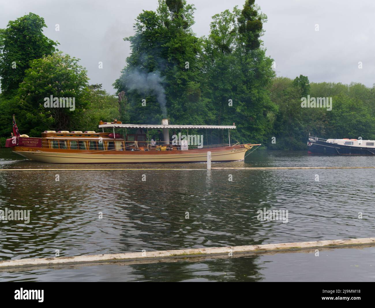 Thames Steamers Limited operates the steam launch 'Alaska', which was built in 1883 and is the oldest working passenger steamer on the Thames. The boa Stock Photo