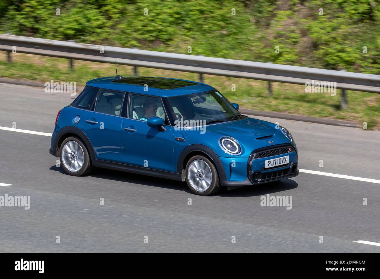 2021 blue Mini Cooper S Exclusive Auto 178 Steptronic Auto Start Stop petrol 4dr hatchback 1998cc Stock Photo