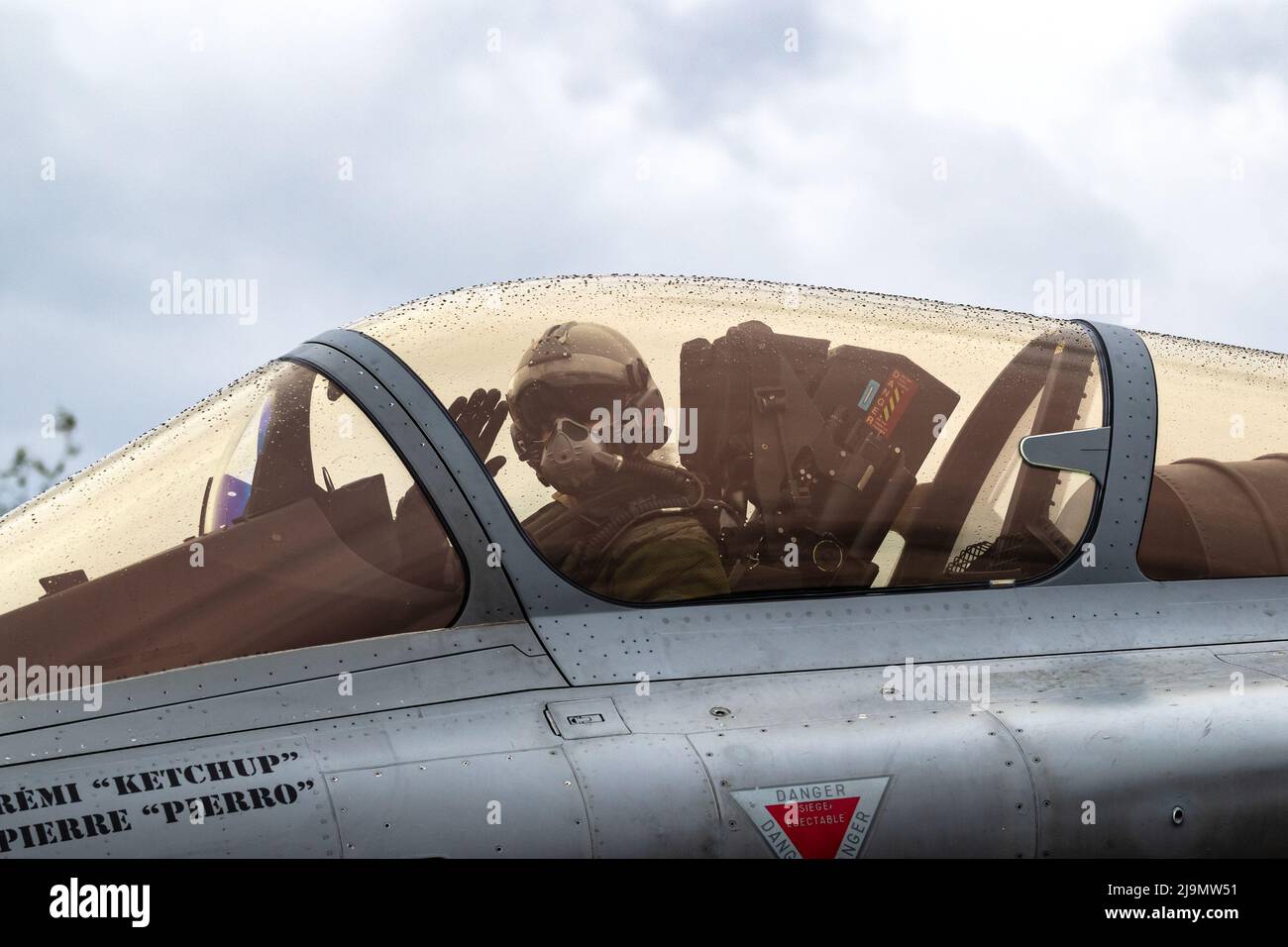 Pilot in the cockpit of a special painted Dassault Rafale fighter jet plane taxiing towards the runway at Mont-de-Marsan Airbase. France - May 17, 201 Stock Photo