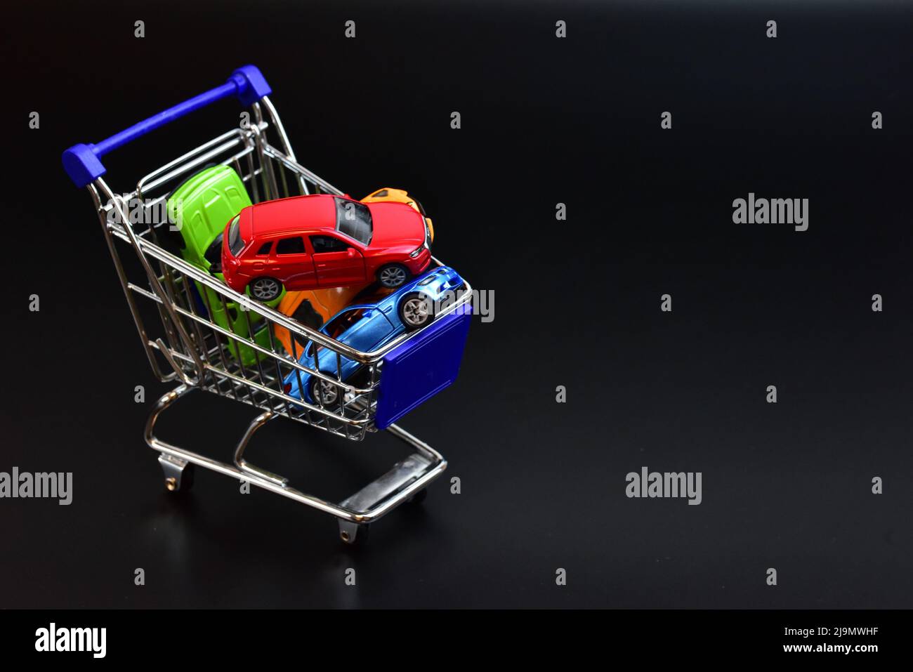 shopping cart with toy cars Stock Photo Alamy