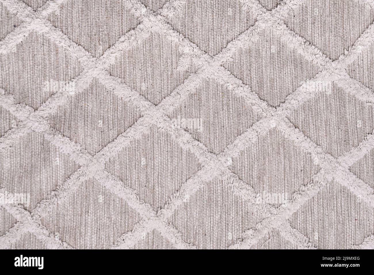 Cream colored carpet with boho style pattern Stock Photo