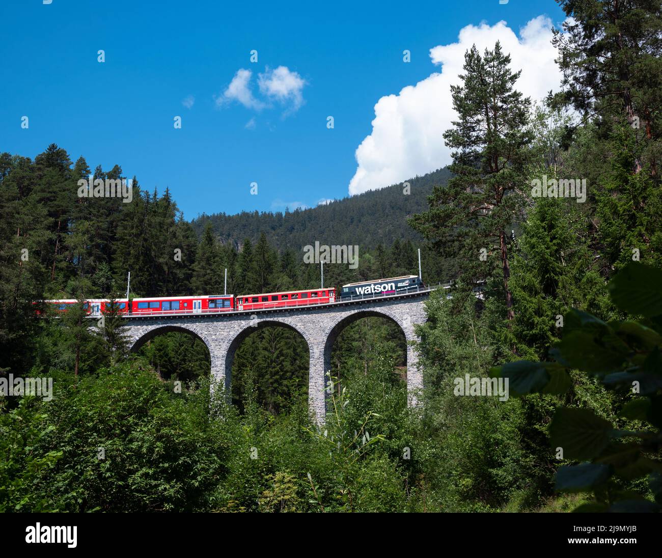 The red Rhatische Bahn train near the famous Landwasser viaduct ...