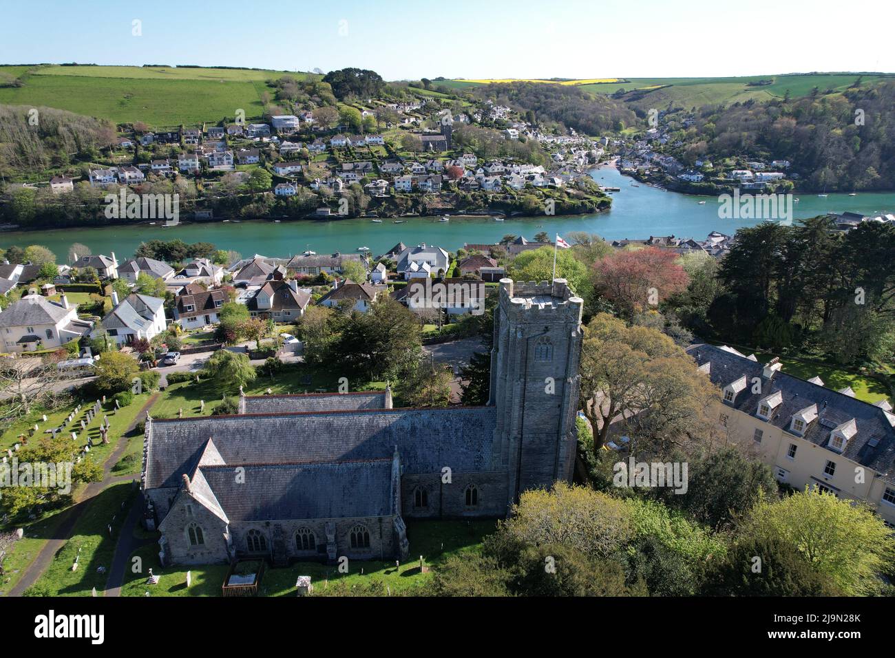 holy-cross-church-newton-ferrers-village-in-south-devon-drone-aerial
