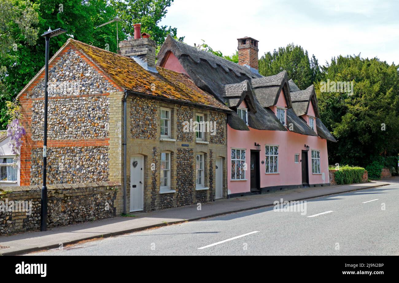 A view of picturesque cottages including the Grade 2 listed pink coloured Church Cottage in Lavenham, Suffolk, England, United Kingdom. Stock Photo