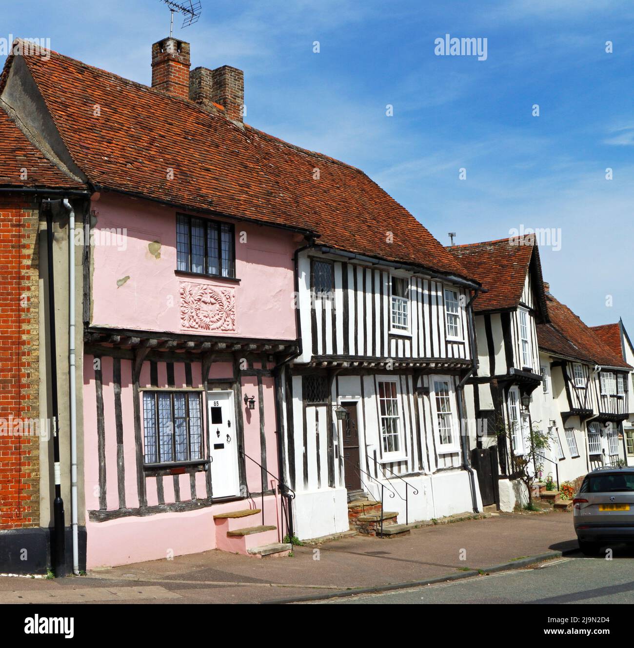 A view of medieval timber-framed buildings of C16-C17 origin in the well preserved medieval village of Lavenham, Suffolk, England, United Kingdom. Stock Photo