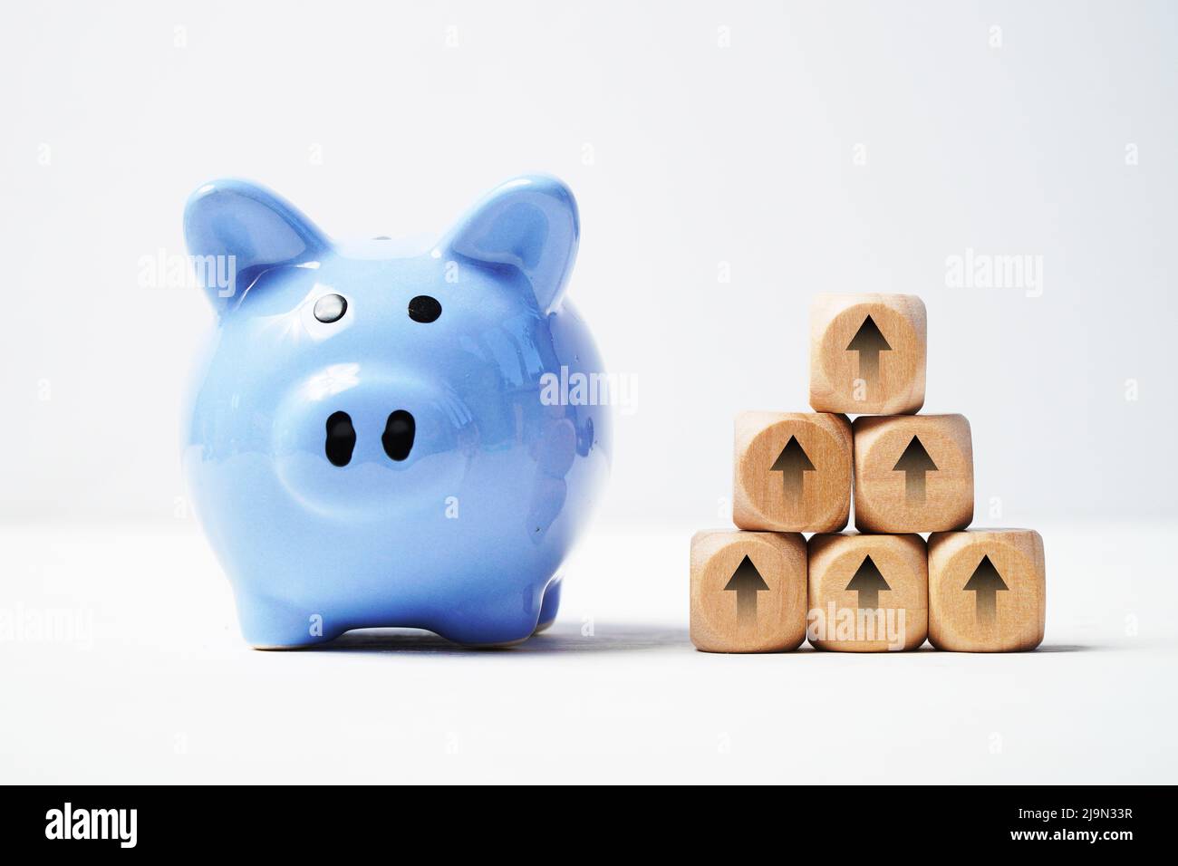 Growth concept. Piggy bank and cubes with up arrows. Accumulation of ...