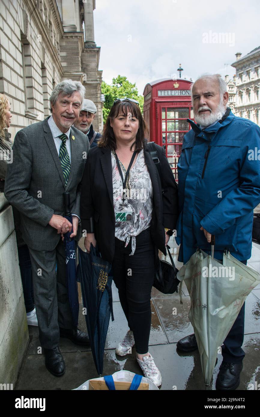 Mickey Brady, Francie Molloy and Michelle Gildernew attends, the British government plan to change the law in relation to the British agent and soldier who murder Irish Catholic and Irish Republic exempt from prosecution. The victims of the families here to seeking justice curry a coffin in front of Downing street, London, UK. - 24 May 2022. Stock Photo