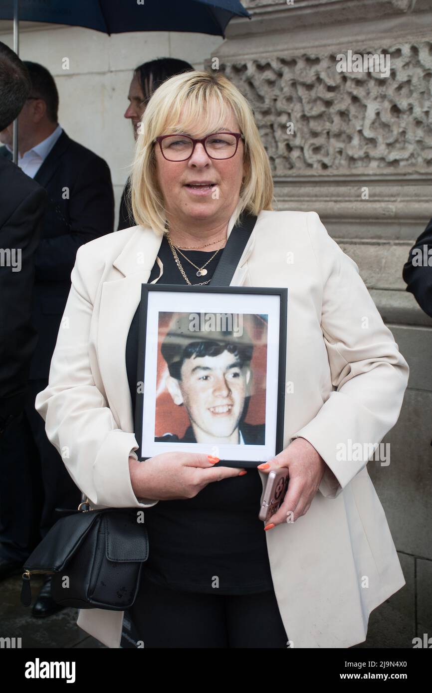 The victims of the families holding a photo of their son, brother at the British agent and soldier who murder Irish Catholic and Irish Republic exempt from prosecution. The victims of the families here to seeking justice curry a coffin in front of Downing street, London, UK. - 24 May 2022. Stock Photo