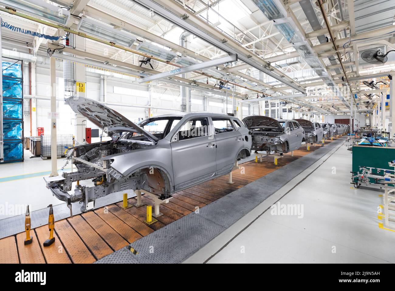 Plant for production of cars. Modern automotive industry. Electric car factory, conveyor Stock Photo
