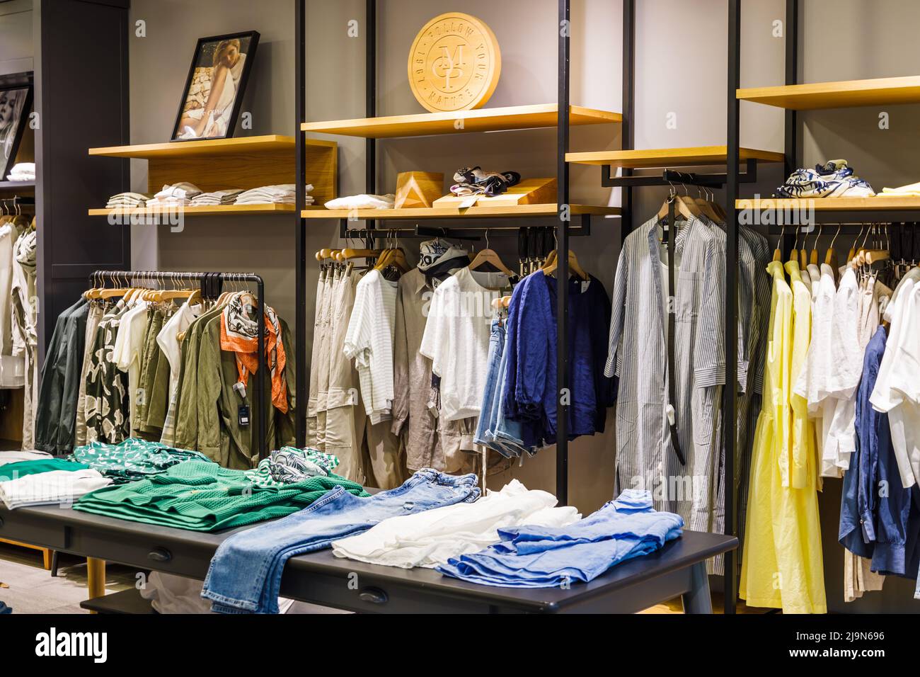 Interior of a contemporary luxury fashion store Stock Photo - Alamy