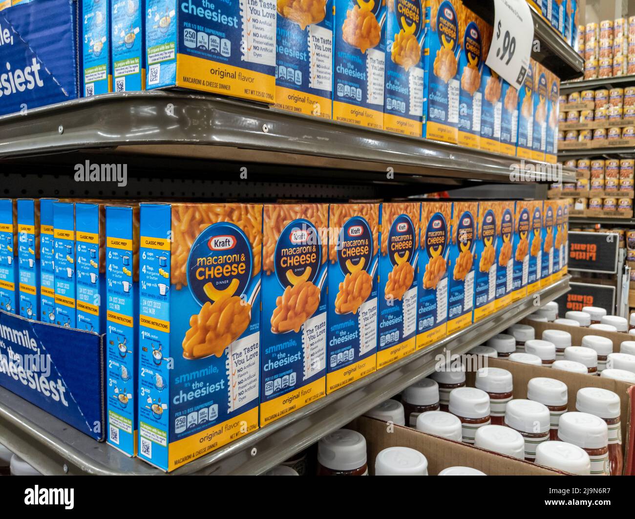 Mill Creek, WA USA - circa May 2022: Angled view of Kraft macaroni and cheese boxes on the end cap of a Town and Country grocery store. Stock Photo
