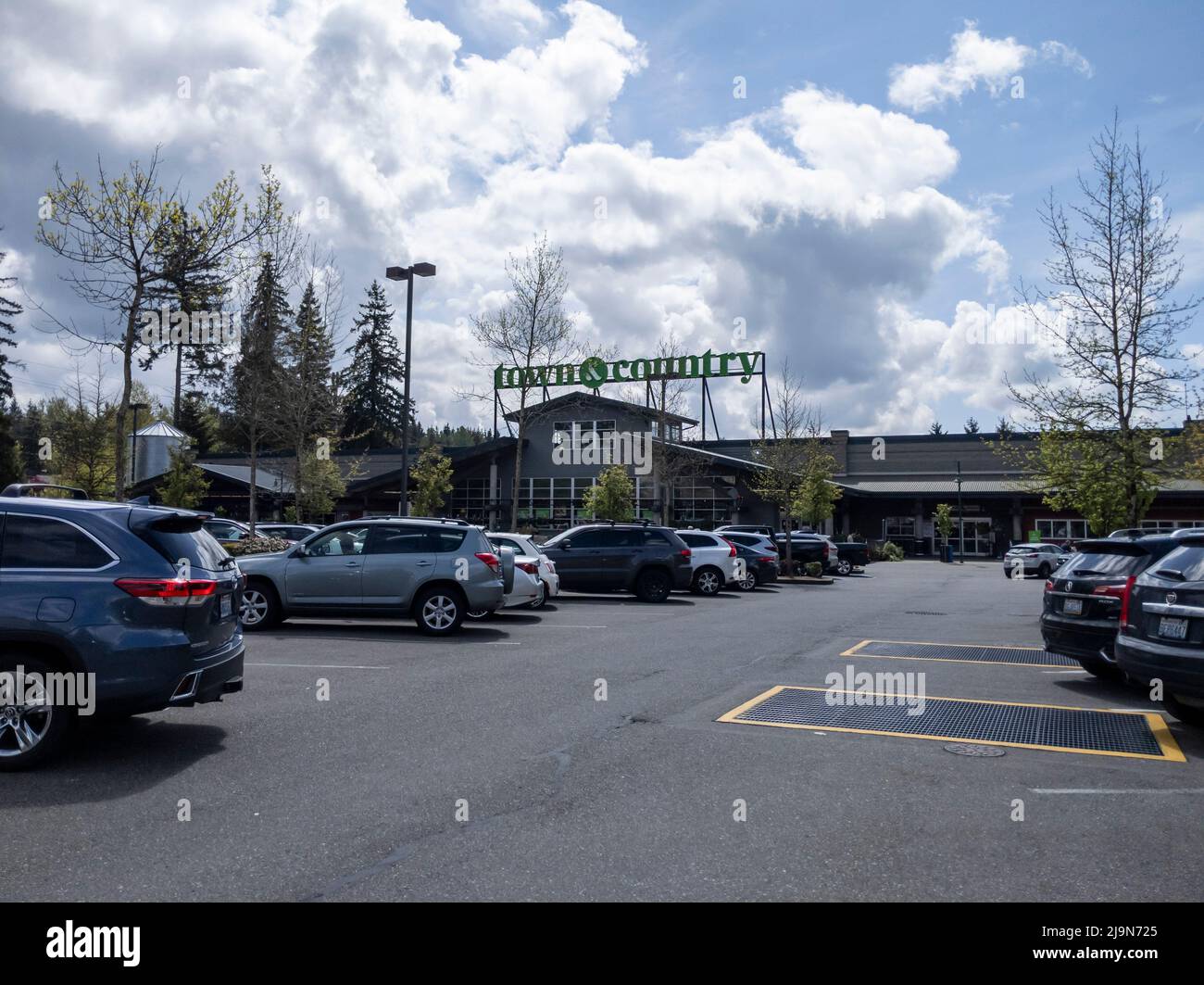 Mill Creek, WA USA - circa May 2022: Exterior view of a Town and Country grocery store on a sunny, cloudy day Stock Photo