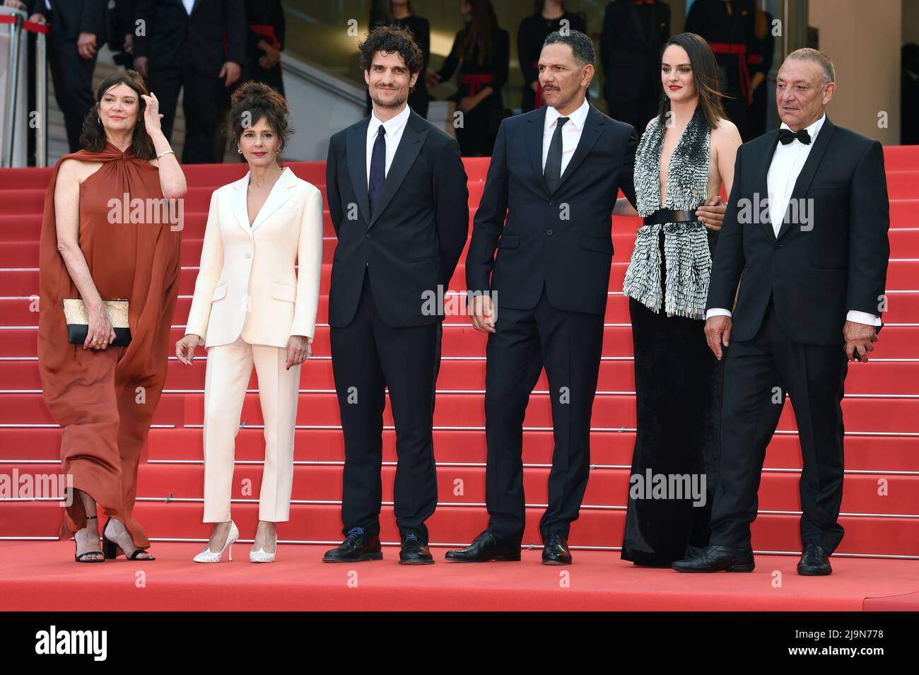(L to R) Anne-Dominique Toussaint, Anouk Grinberg, Louis Garrel, Roschdy Zem, and Noemie Merlant attend the 75th Anniversary celebration screening of 'The Innocent (L'Innocent)' during the 75th Cannes Film Festival in Cannes, France. Stock Photo