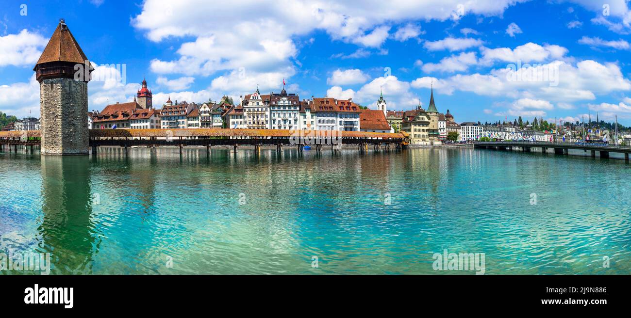 Panoramic view of Lucerne (Luzern) town with famous Chapel wooden bridge over Reuss river.  Switzerland travel and landmarks. Stock Photo